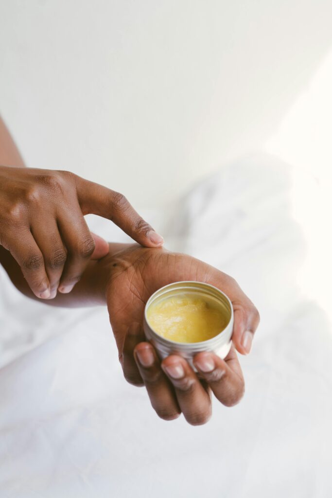 Natural skincare balm being applied for daily beauty routine
