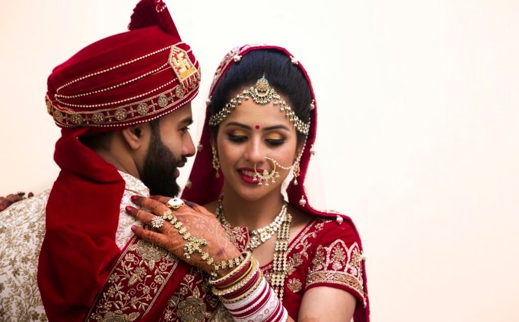 Couple in coordinated maroon traditional outfits