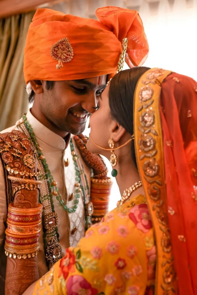 Couple in orange and yellow festive outfits