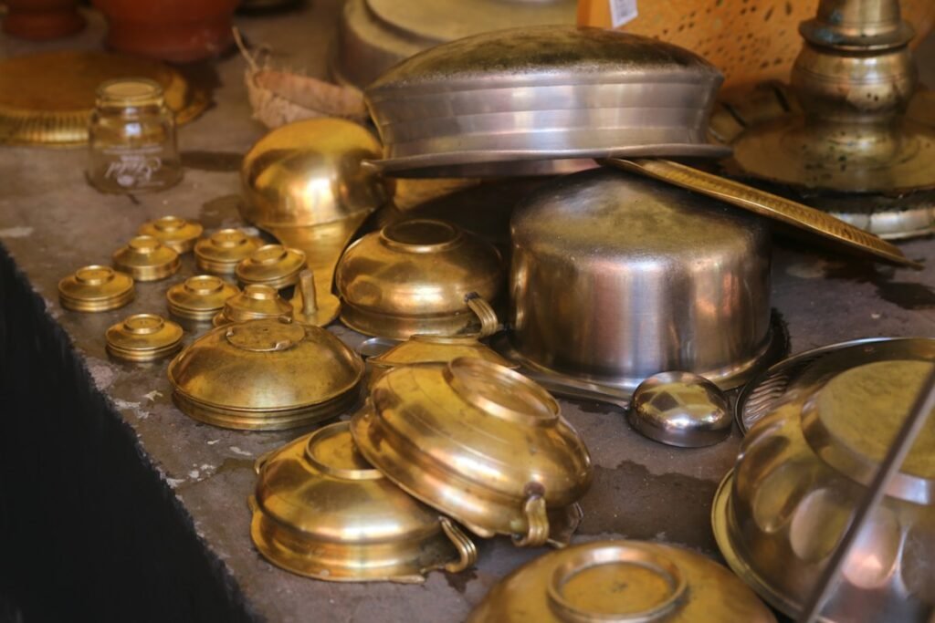 Shiny brass pots and vessels on a table