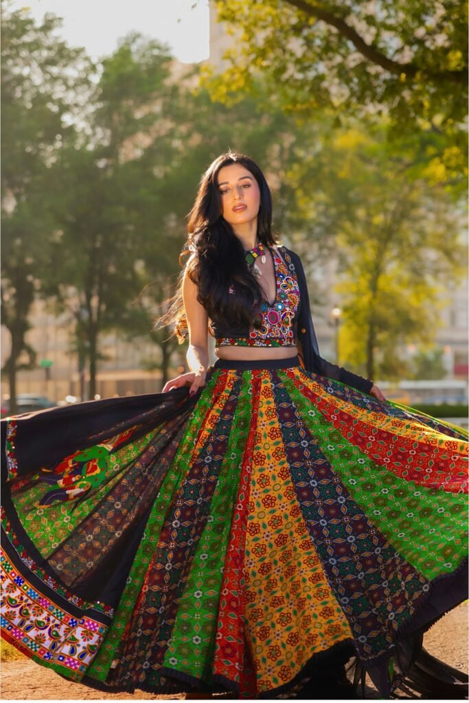 Sweat-Proof Skincare for Garba and Festive Nights (Men and Women) Woman twirling in a colourful chaniya choli lehenga