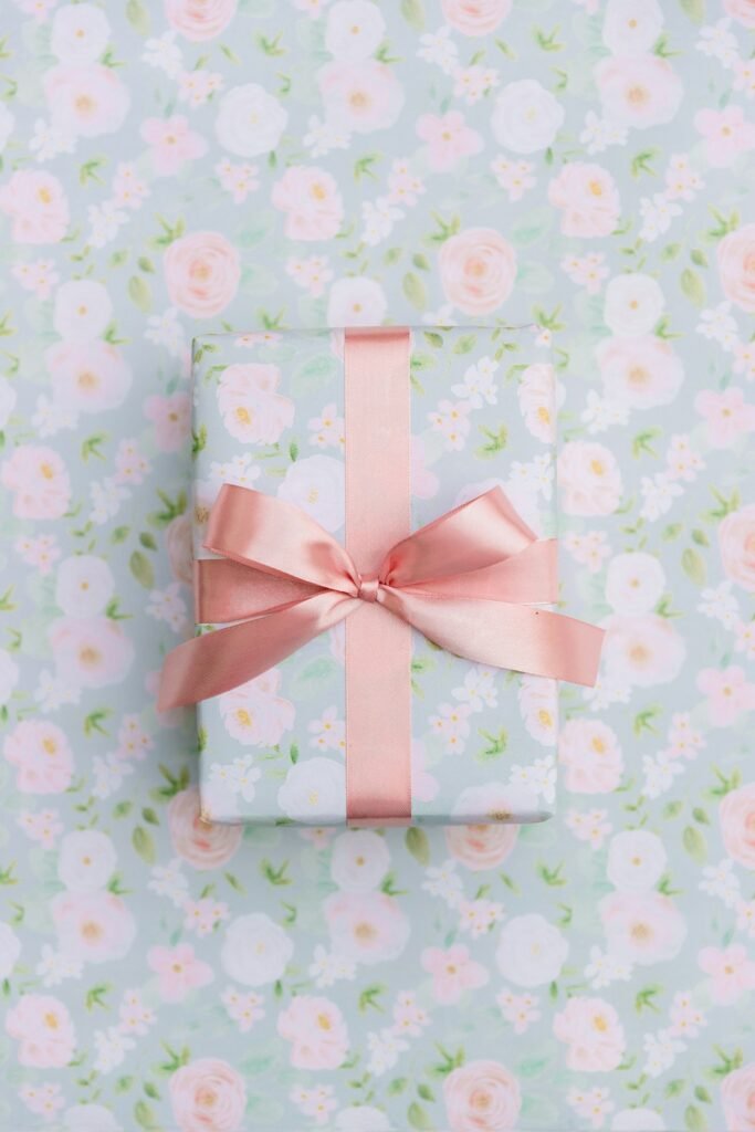 Gift wrapped in floral paper with a peach ribbon