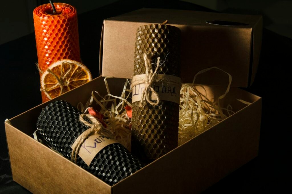 Handmade candles packed in a kraft gift box