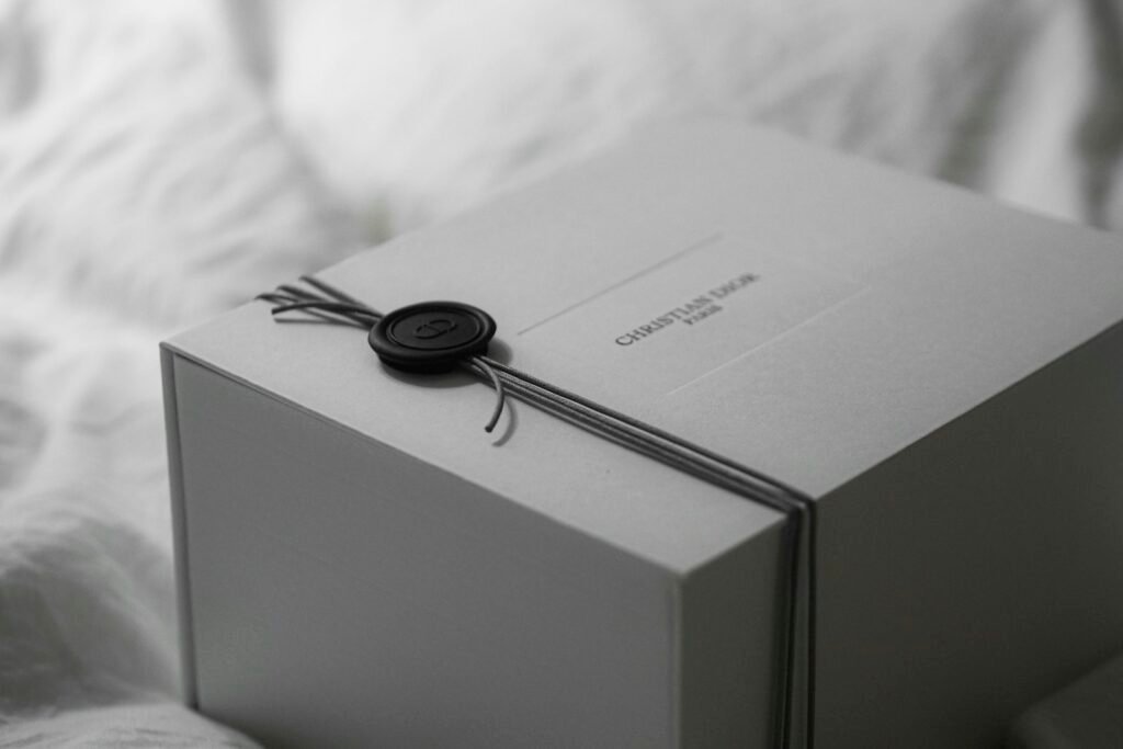10 Luxury Diwali Gifts for Him and Her (₹5,000–₹30,000) in 2026 White premium gift box tied with ribbon and a wax seal